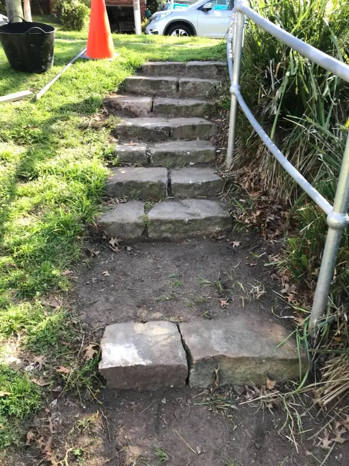 Restored stone access steps with a safety handrail