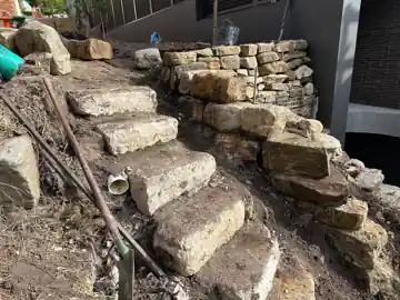Restored sandstone steps and walling